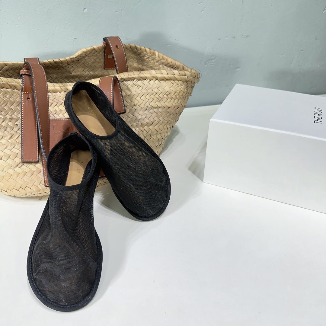 THE ROW 26S SOCK FLATS IN BLACK MESH