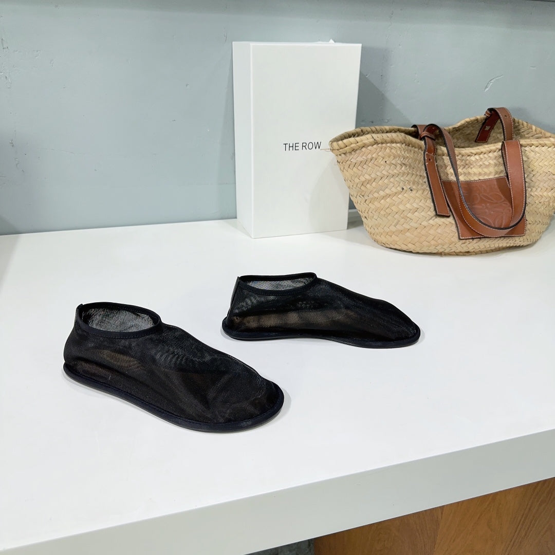THE ROW 26S SOCK FLATS IN BLACK MESH