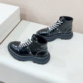 MCQUEEN LEATHER ANKLE BOOT IN BLACK MIX WHITE LAMBSKIN