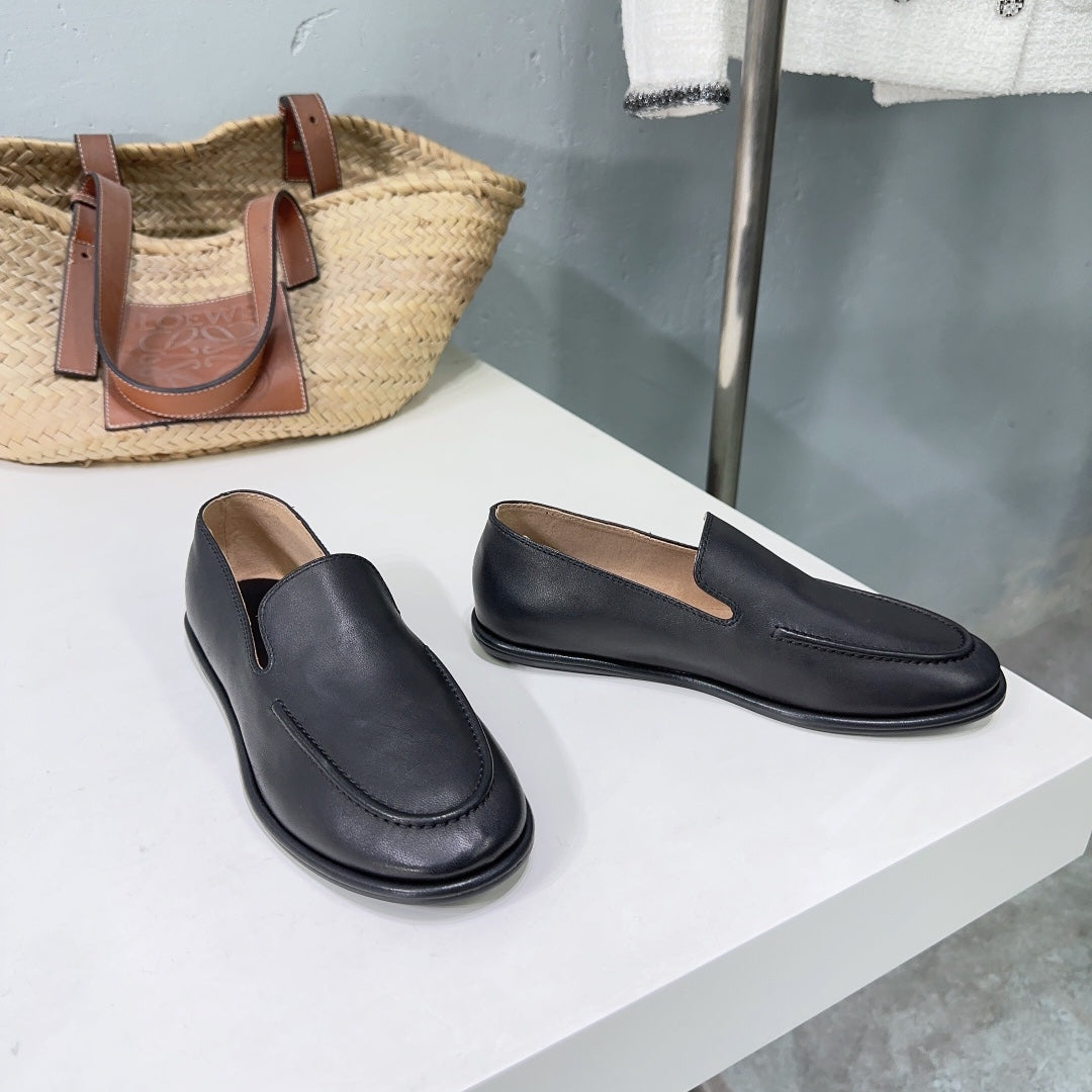 THE ROW 26S CLASSIC LOAFERS IN BLACK CALFSKIN