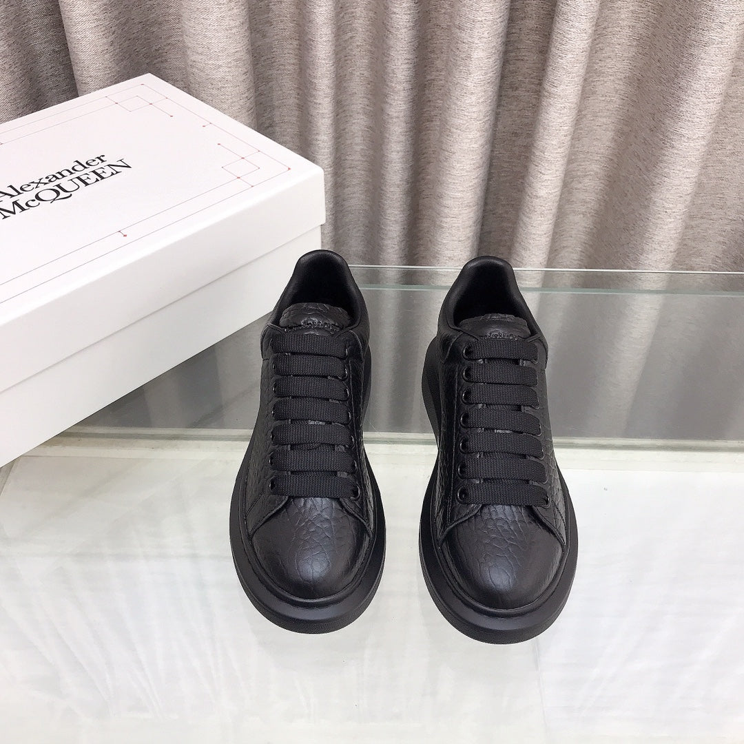 OVERSIZED SNEAKERS IN BLACK TEXTURED CALFSKIN EMBOSSED LOGO