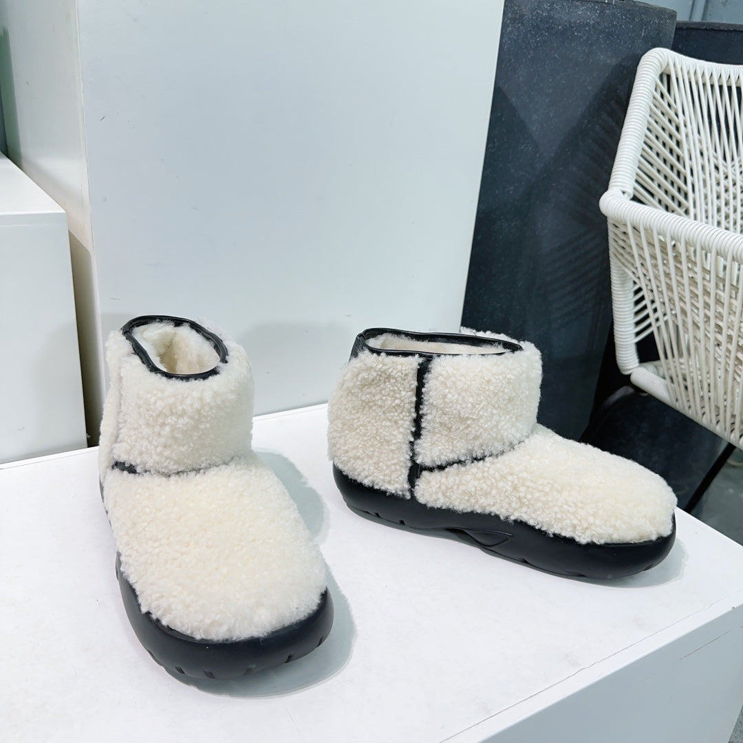 MINI ANKLE BOOT IN WHITE SHEARLING WITH BLACK ULTRA LIGHTWEIGHT RUBBER OUTSOLE