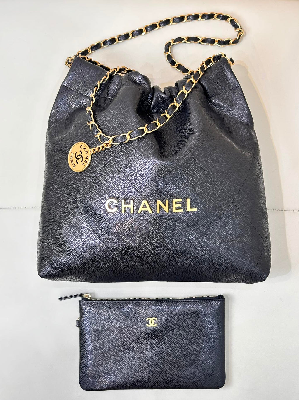 CHANEL 26S DRAWSTRING SHOULDER BAG 22 IN BLACK CAVIAR CALFSKIN