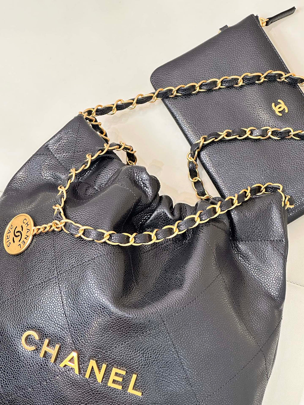 CHANEL 26S DRAWSTRING SHOULDER BAG 22 IN BLACK CAVIAR CALFSKIN