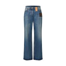 HIGH WAIST JEANS IN SIGNATURE MONOGRAM PATCH DENIM