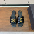 BALMAIN 26S QUILTED MULES IN BLACK CALFSKIN