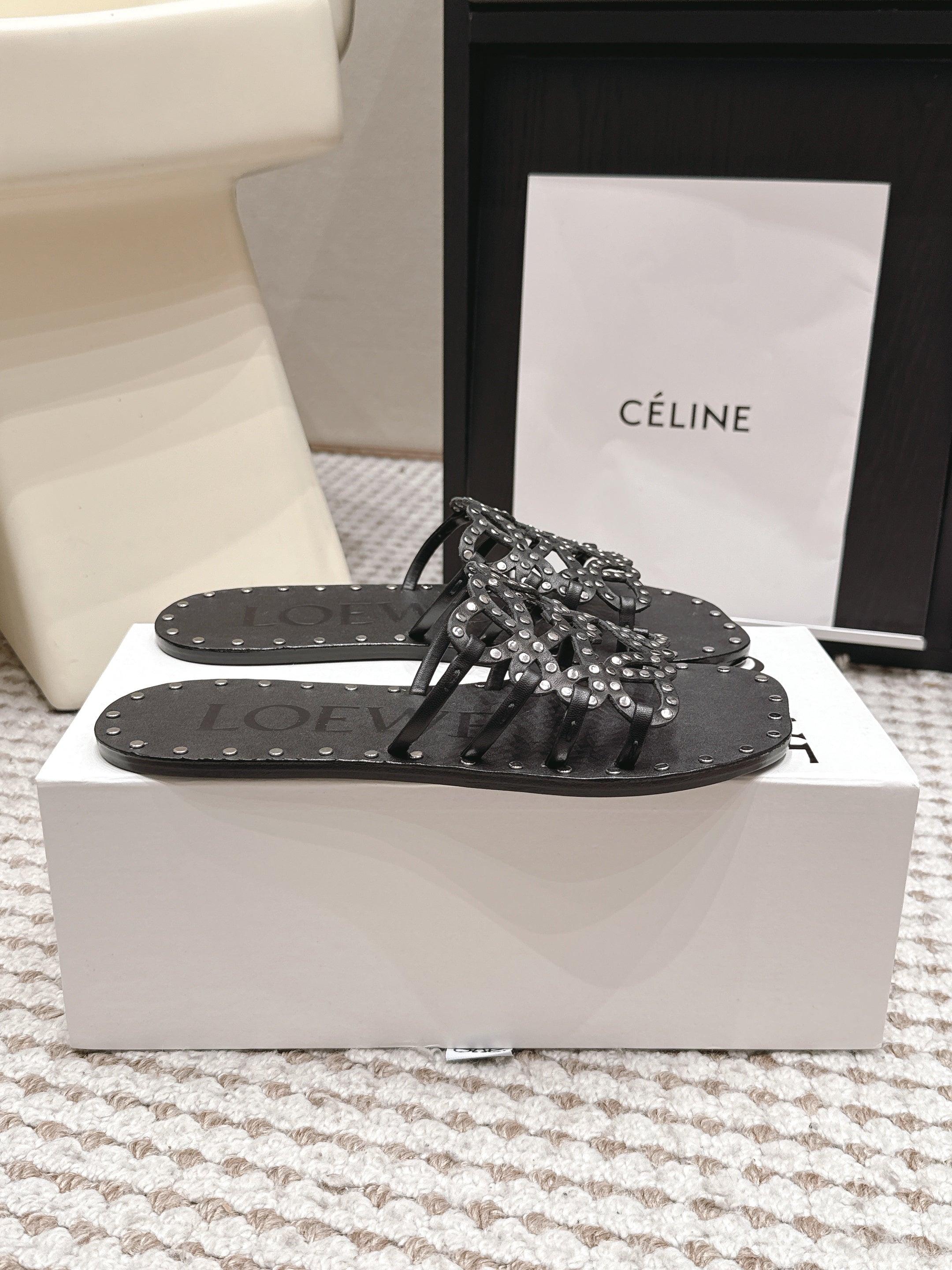 LOEWE 26S PETAL ANAGRAM SLIDE IN BLACK CALFSKIN WITH STUDS