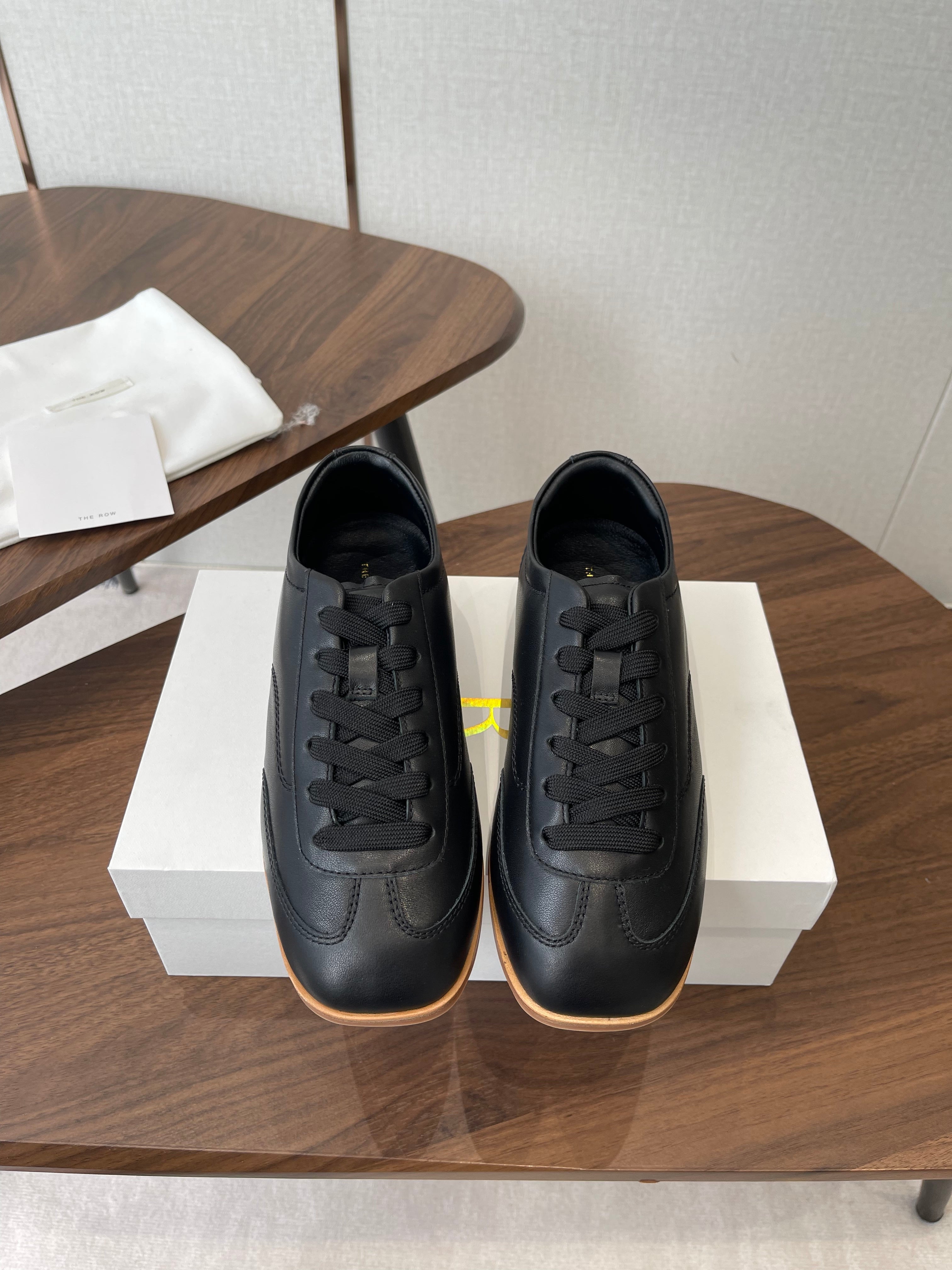 THE ROW 26S SNEAKERS IN BLACK CALFSKIN