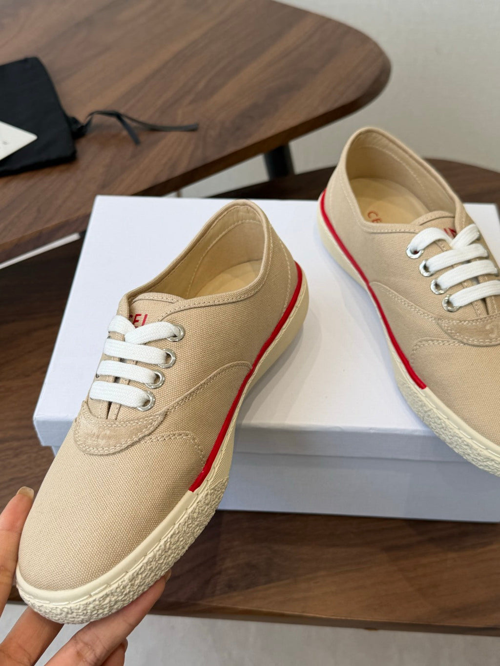 CELINE 26S TRIOMPHE LOW TOP SNEAKERS IN BEIGE CANVAS RED TRIM