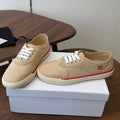 CELINE 26S TRIOMPHE LOW TOP SNEAKERS IN BEIGE CANVAS RED TRIM