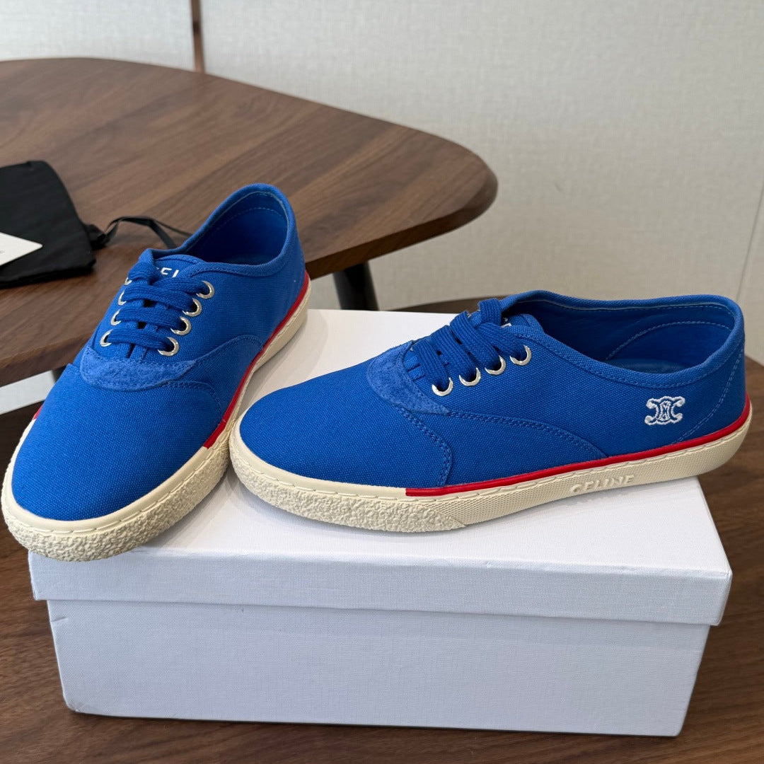 CELINE 26S TRIOMPHE LOW TOP SNEAKERS IN BLUE CANVAS RED TRIM