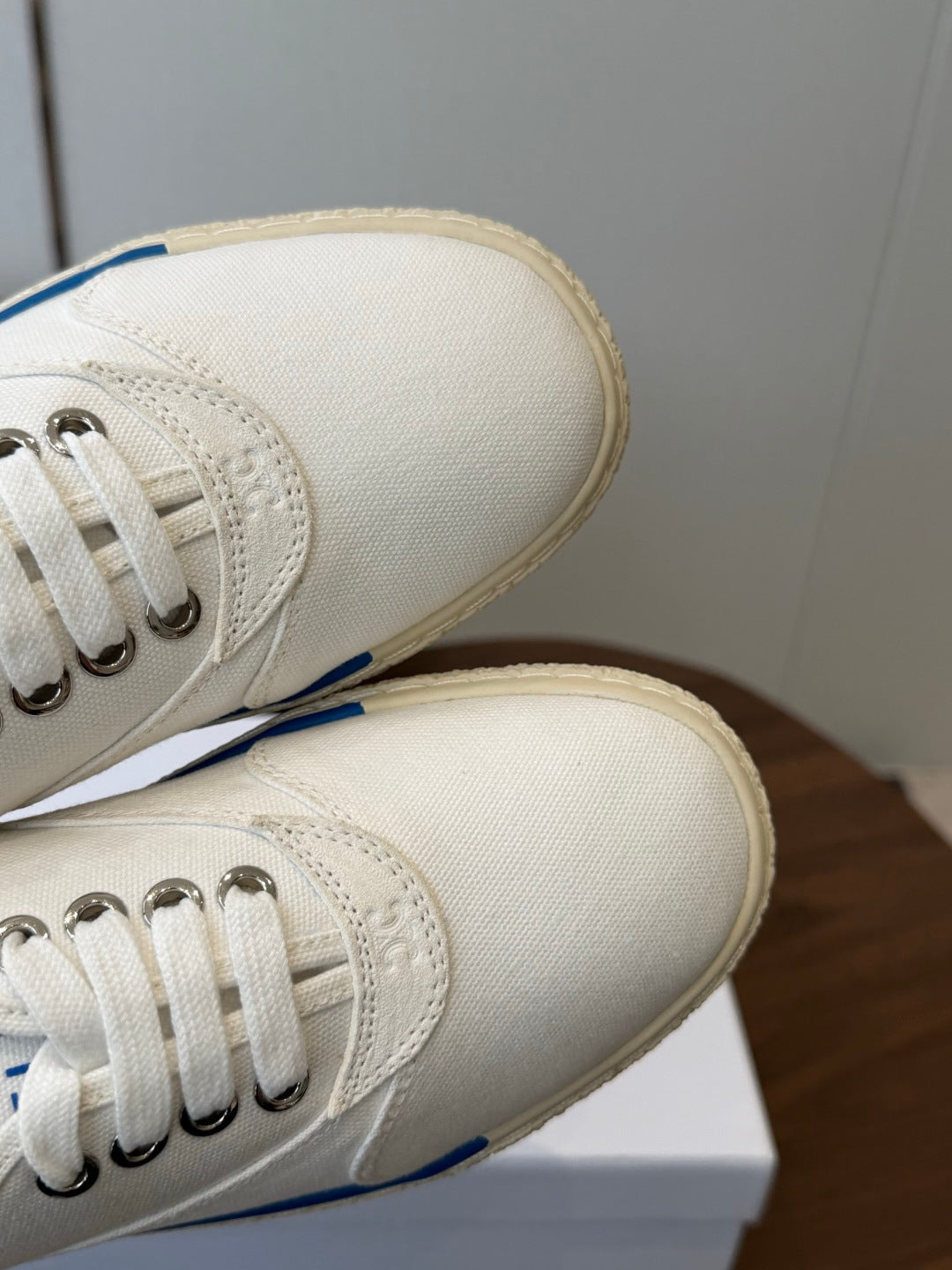 CELINE 26S TRIOMPHE LOW TOP SNEAKERS IN WHITE CANVAS BLUE TRIM