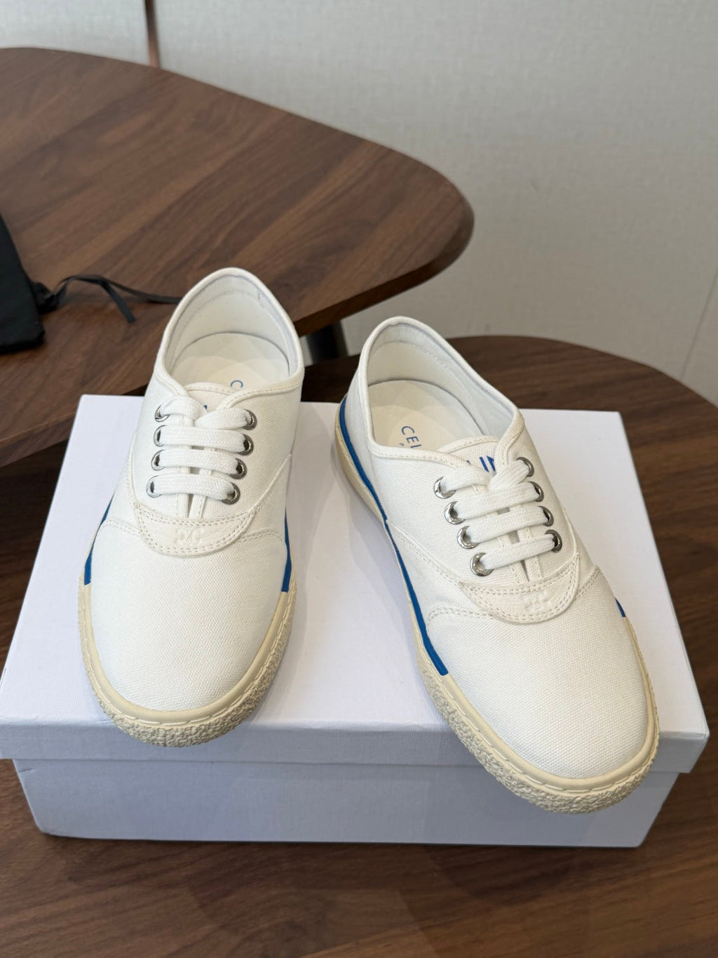 CELINE 26S TRIOMPHE LOW TOP SNEAKERS IN WHITE CANVAS BLUE TRIM