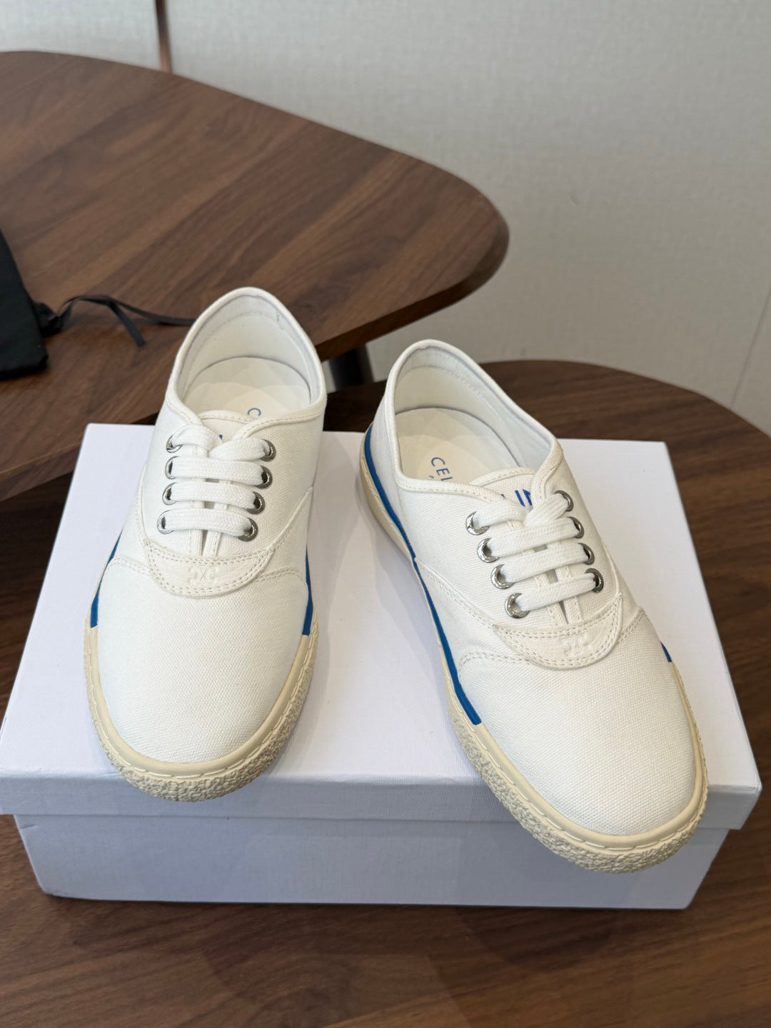 CELINE 26S TRIOMPHE LOW TOP SNEAKERS IN WHITE CANVAS BLUE TRIM