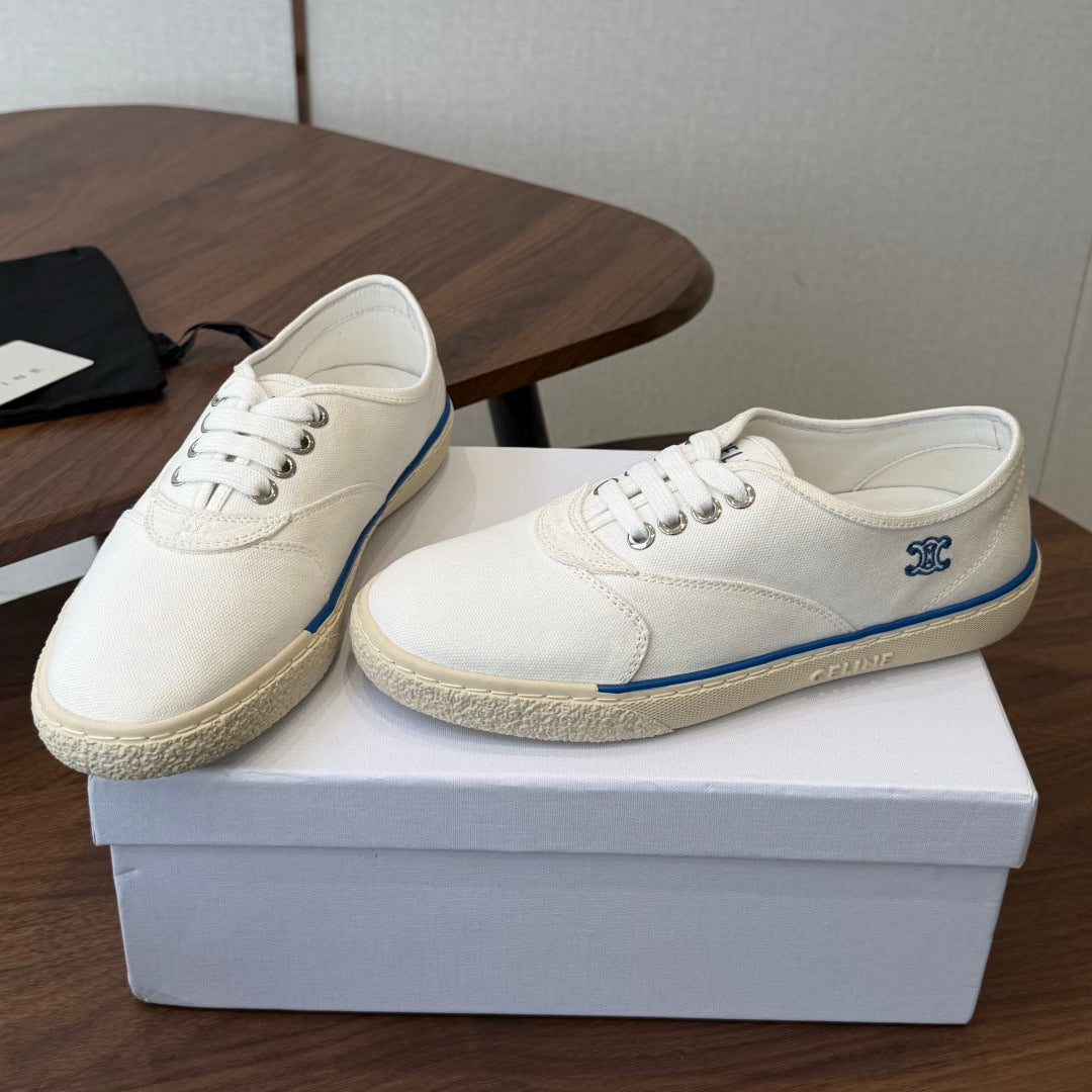 CELINE 26S TRIOMPHE LOW TOP SNEAKERS IN WHITE CANVAS BLUE TRIM
