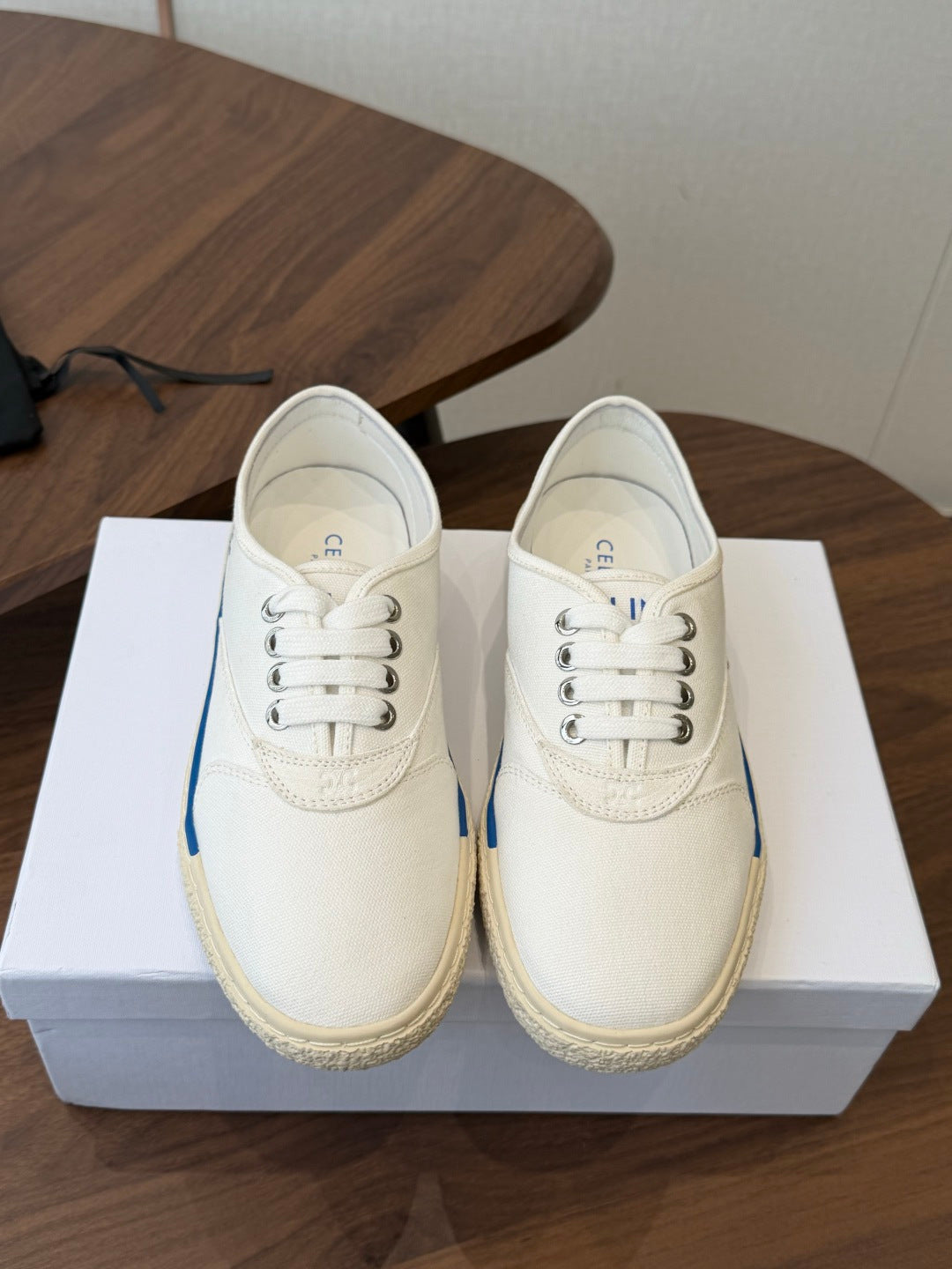 CELINE 26S TRIOMPHE LOW TOP SNEAKERS IN WHITE CANVAS BLUE TRIM