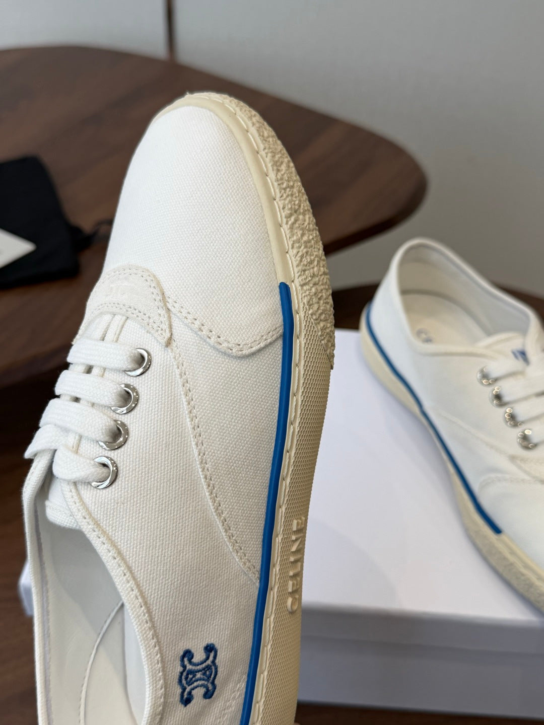 CELINE 26S TRIOMPHE LOW TOP SNEAKERS IN WHITE CANVAS BLUE TRIM