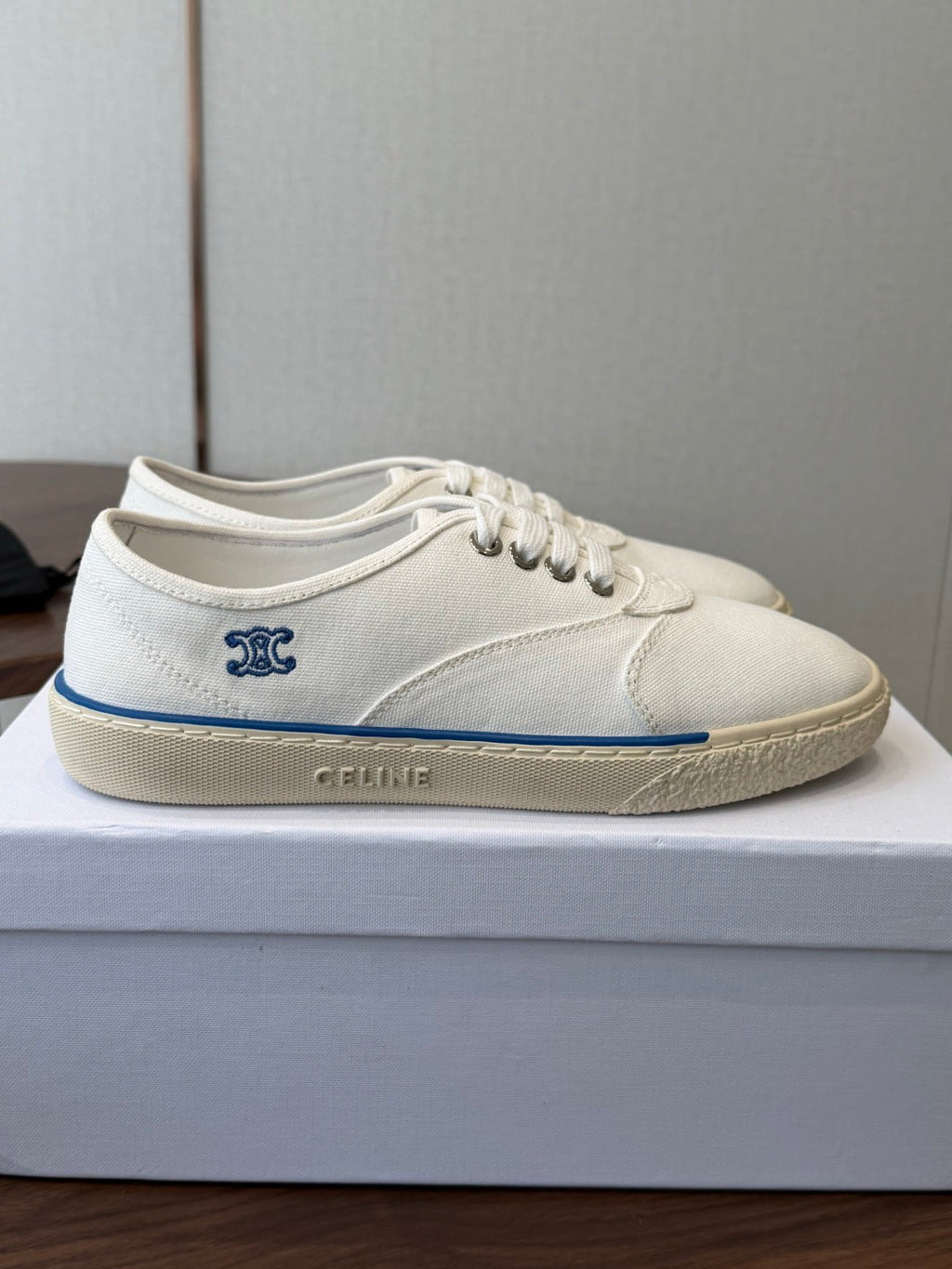 CELINE 26S TRIOMPHE LOW TOP SNEAKERS IN WHITE CANVAS BLUE TRIM