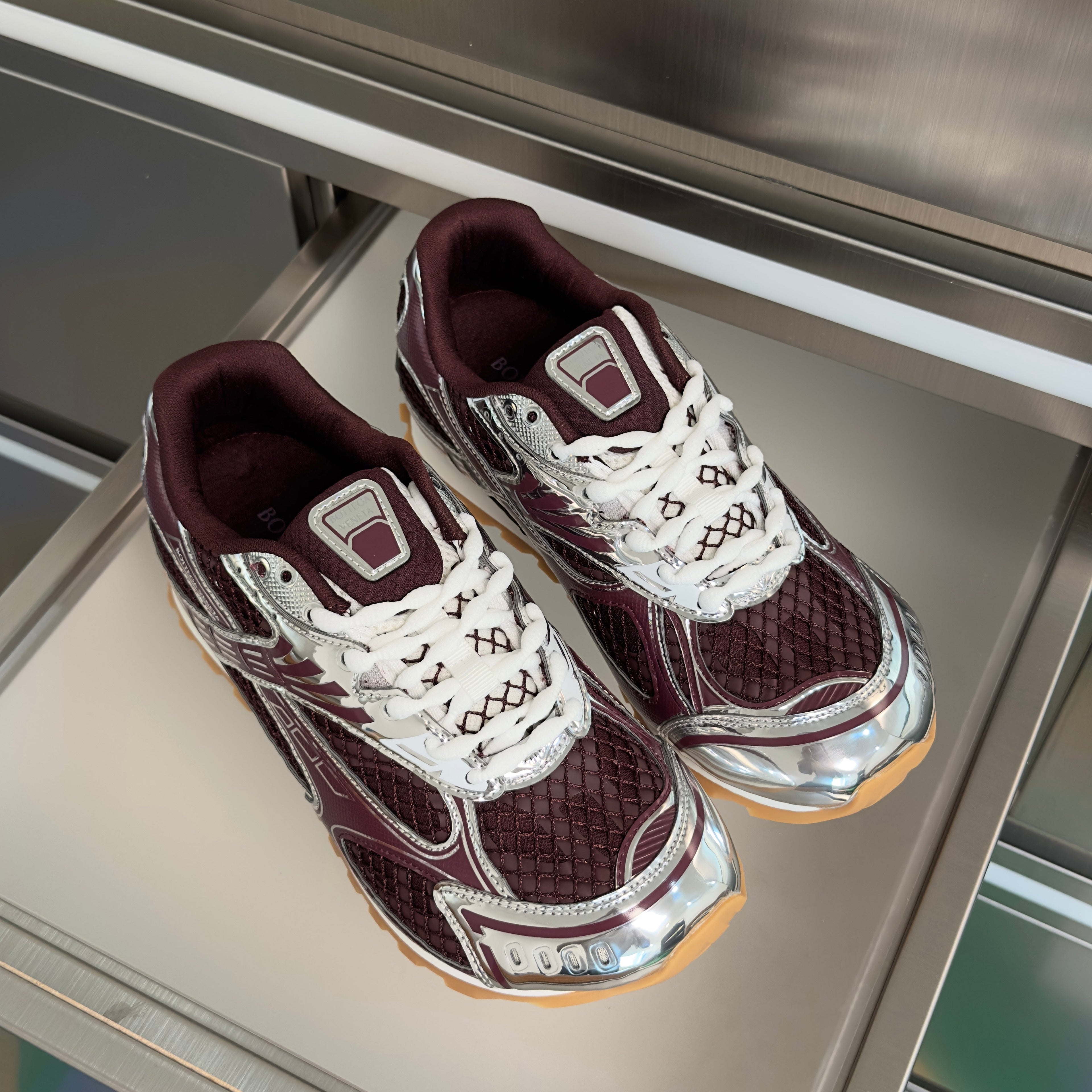 BOTTEGA VENETA 26S SNEAKERS IN DARK RED AND SILVER TPU MATERIAL