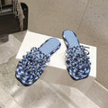 LOEWE 26S BRAIDED CAGE SLIDE SANDALS IN BLUE CALFSKIN