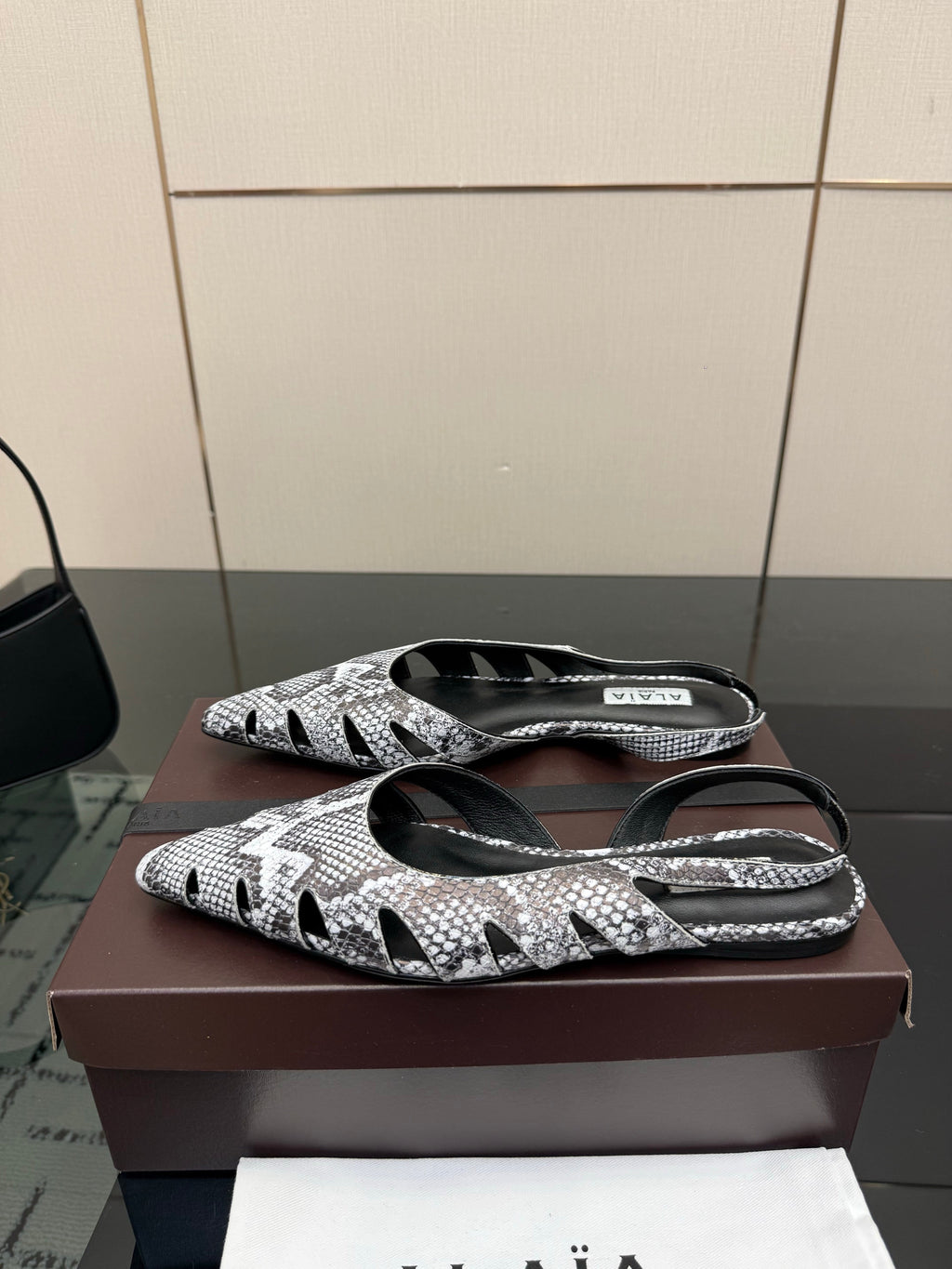 ALAIA 26S CUT-OUT SLINGBACK FLATS IN PYTHON-EMBOSSED LEATHER