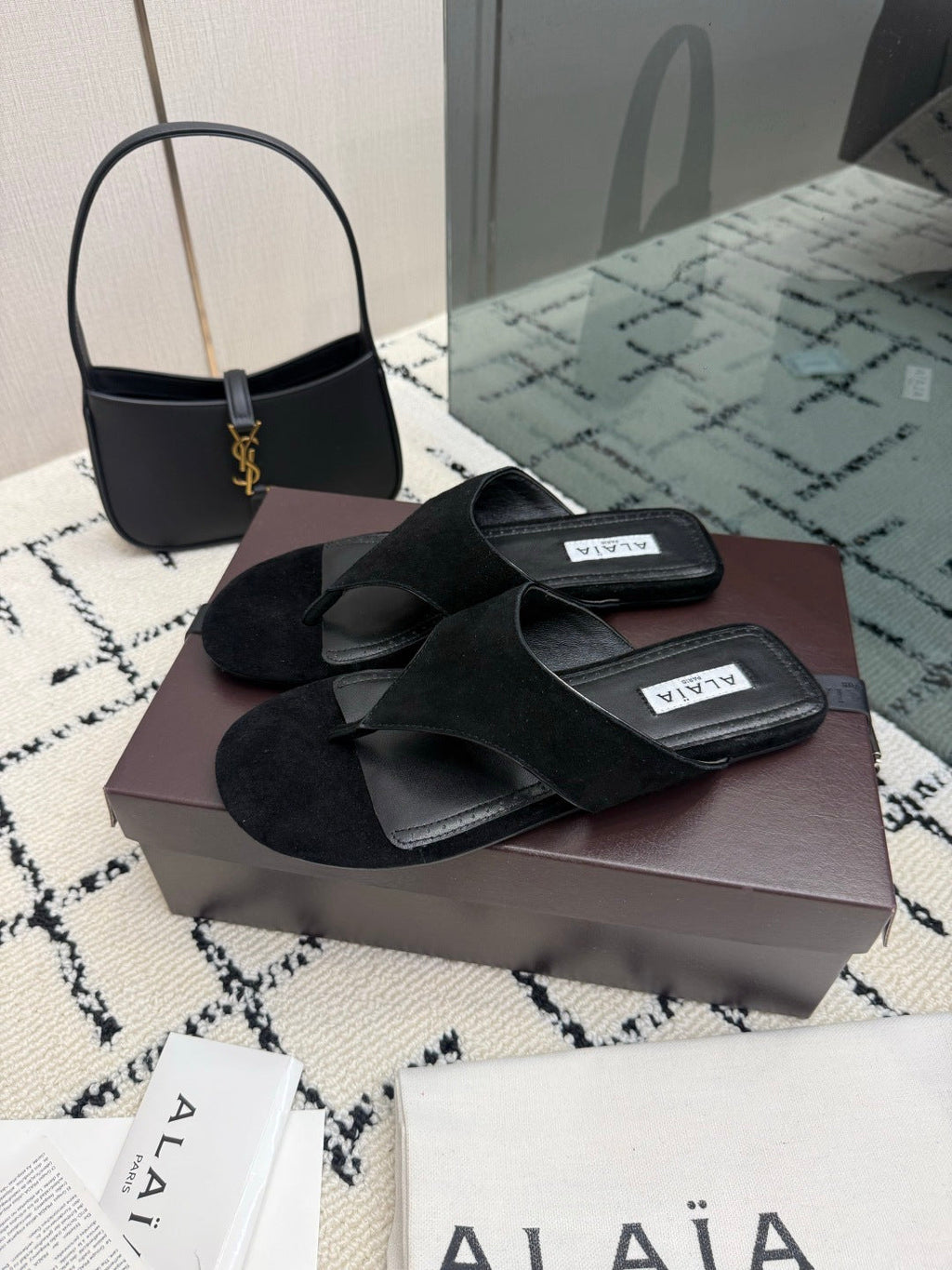 ALAIA 26S THONG MULE SANDALS IN BLACK SUEDE