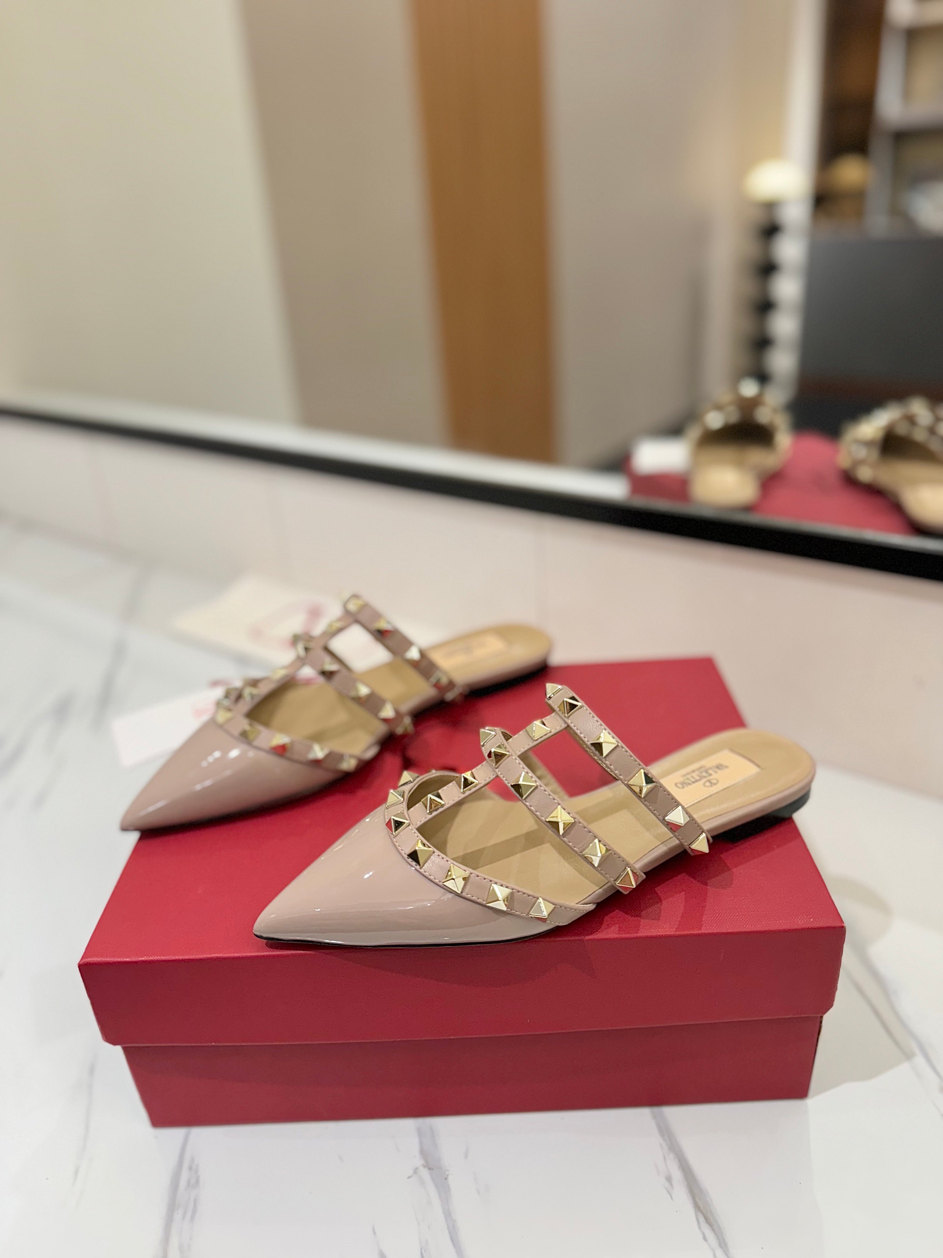 VALENTINO 26S STUDDED FLAT MULES IN NUDE PATENT CALFSKIN