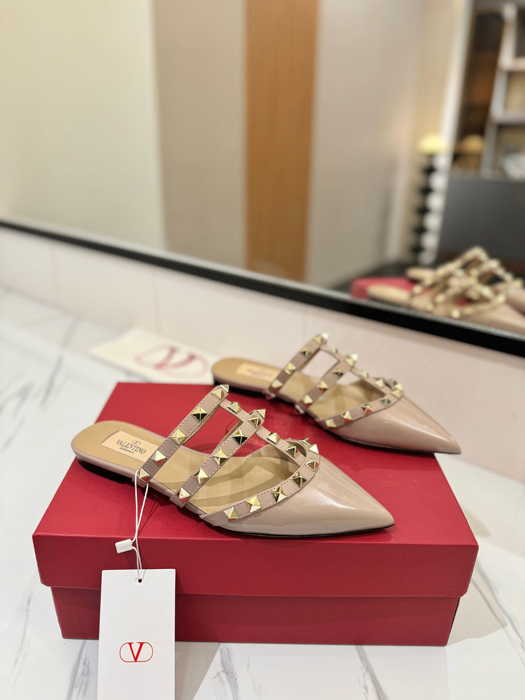 VALENTINO 26S STUDDED FLAT MULES IN NUDE PATENT CALFSKIN