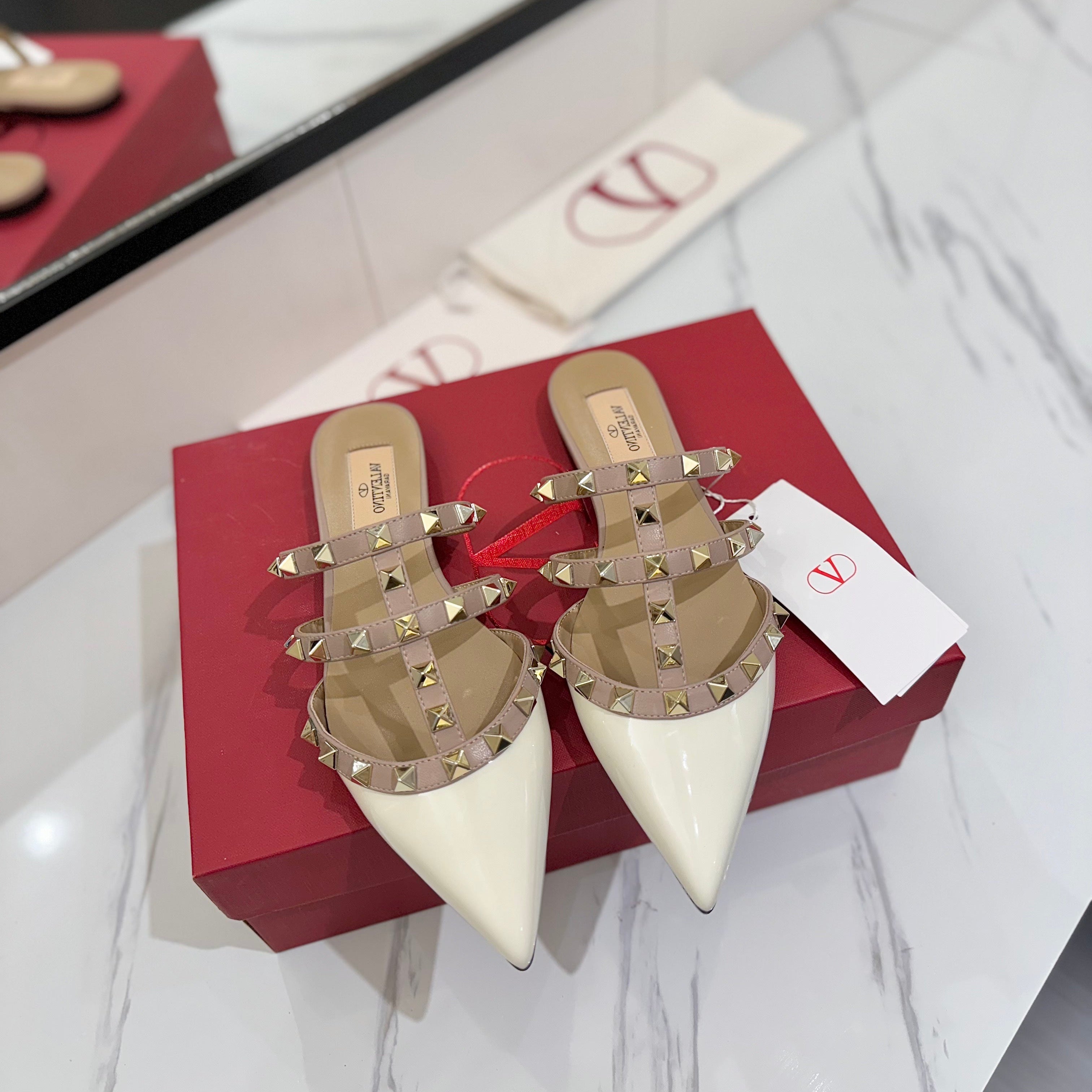 VALENTINO 26S STUDDED FLAT MULES IN WHITE PATENT CALFSKIN