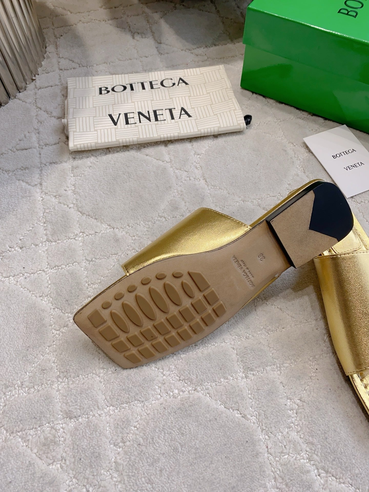 BOTTEGA VENETA 26S FLAT THONG SANDALS IN GOLD LAMBSKIN