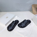 THE ROW 26S CAGE SLIDES IN BLACK SMOOTH CALFSKIN