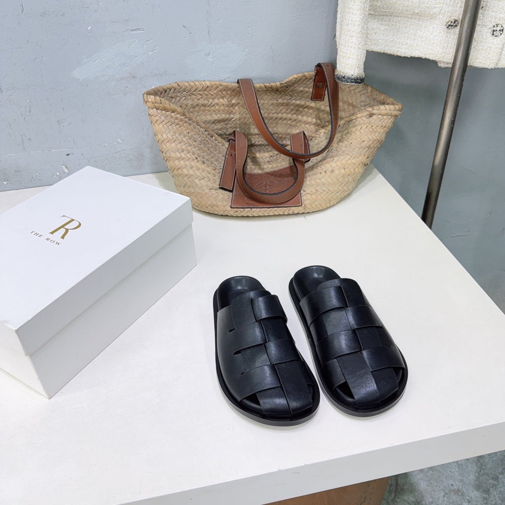 THE ROW 26S CAGE SLIDES IN BLACK SMOOTH CALFSKIN
