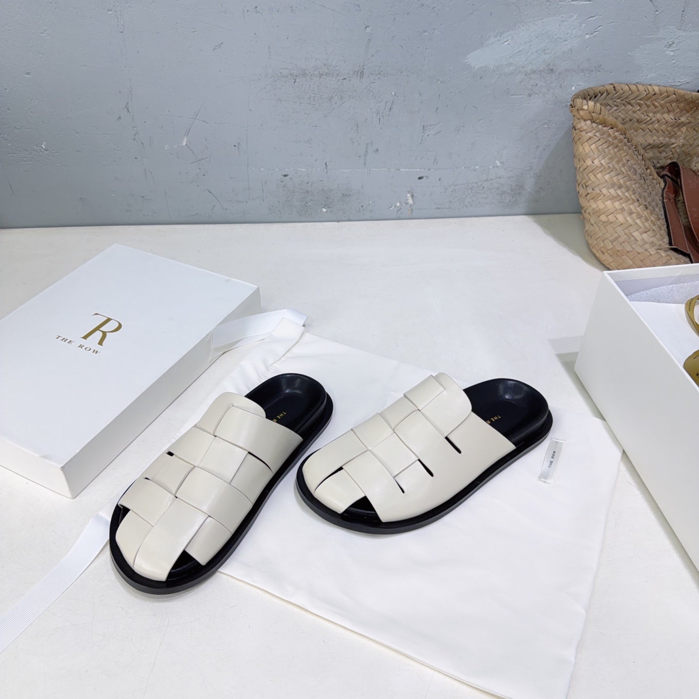 THE ROW 26S CAGE SLIDES IN IVORY WHITE SMOOTH CALFSKIN WITH BLACK FOOTBED