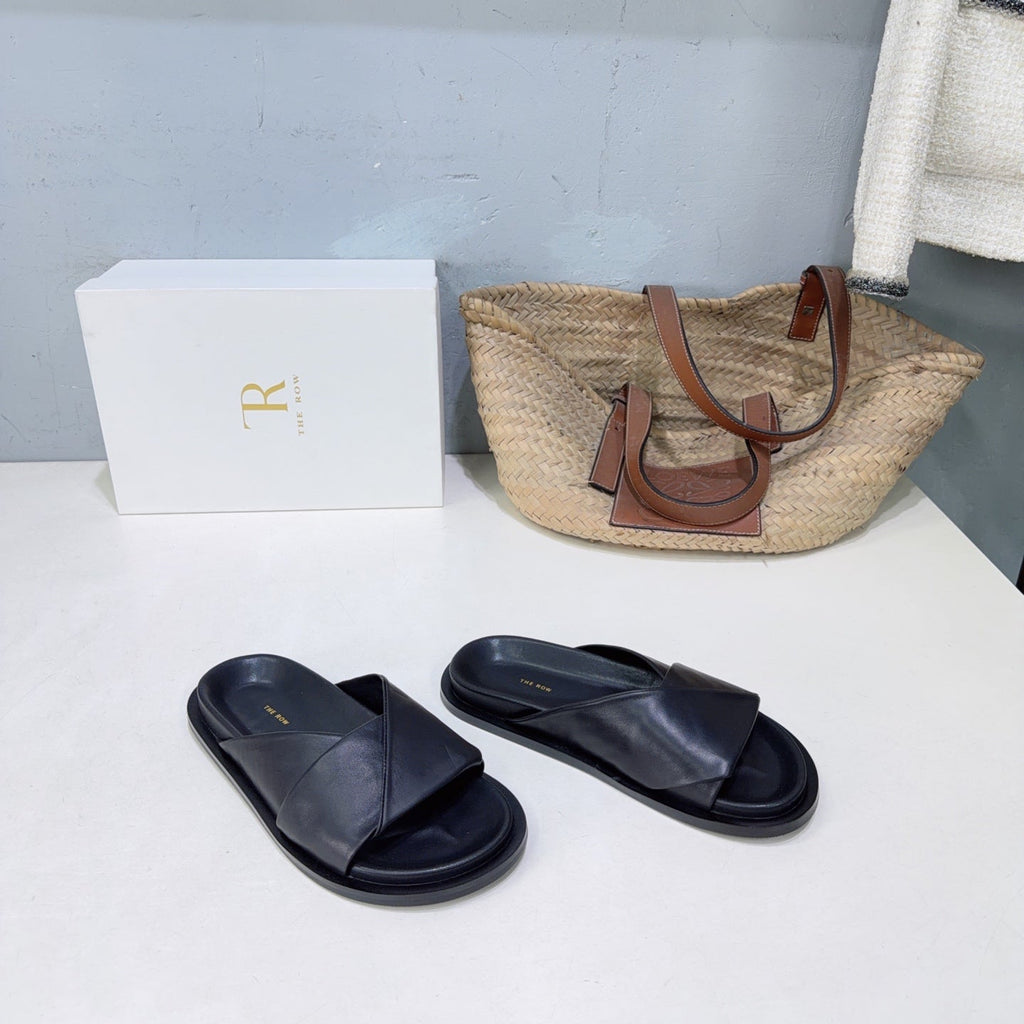 THE ROW 26S CROSS STRAP SLIDES IN BLACK CALFSKIN