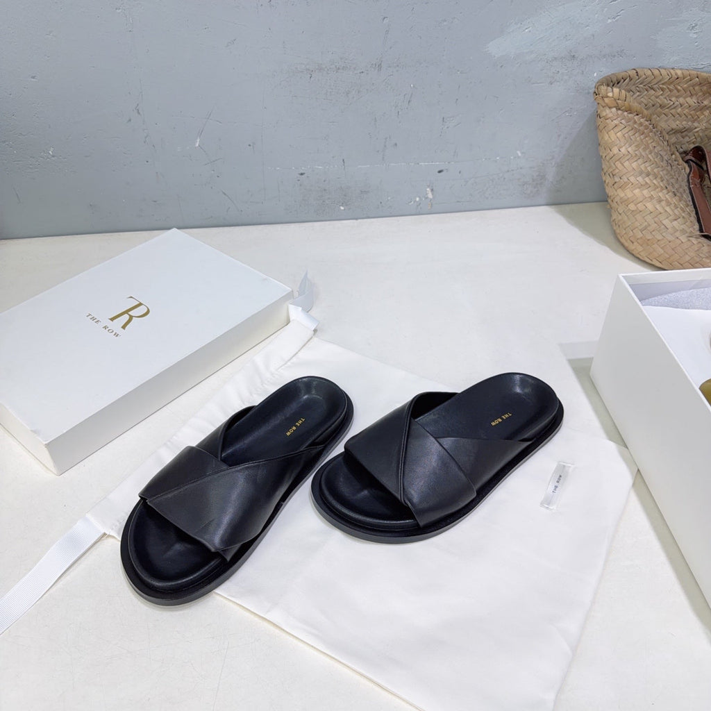 THE ROW 26S CROSS STRAP SLIDES IN BLACK CALFSKIN