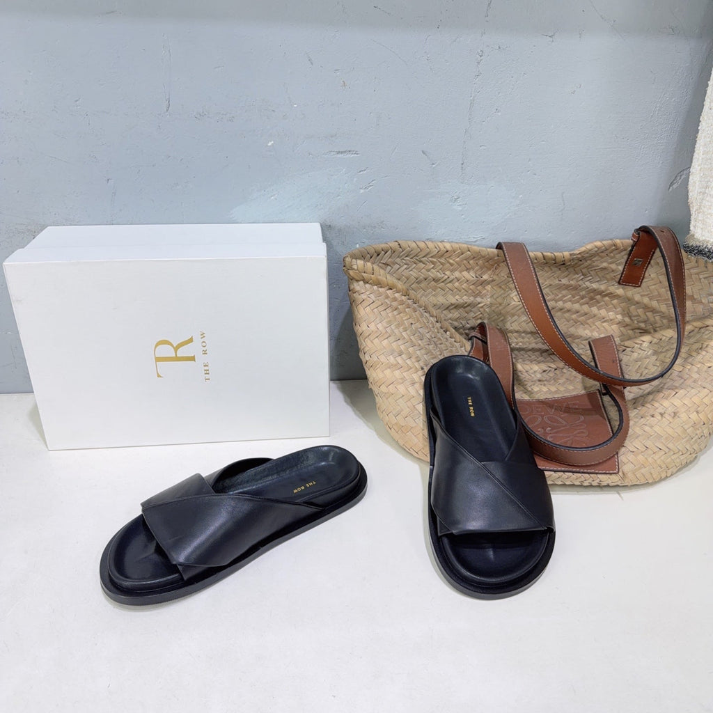 THE ROW 26S CROSS STRAP SLIDES IN BLACK CALFSKIN