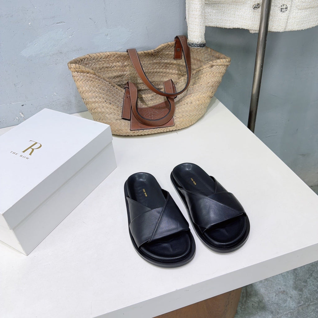 THE ROW 26S CROSS STRAP SLIDES IN BLACK CALFSKIN