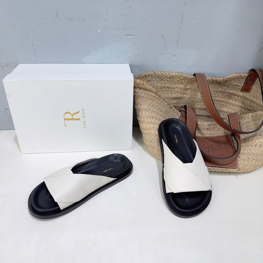 THE ROW 26S CROSS STRAP SLIDES IN IVORY WHITE CALFSKIN WITH BLACK FOOTBED