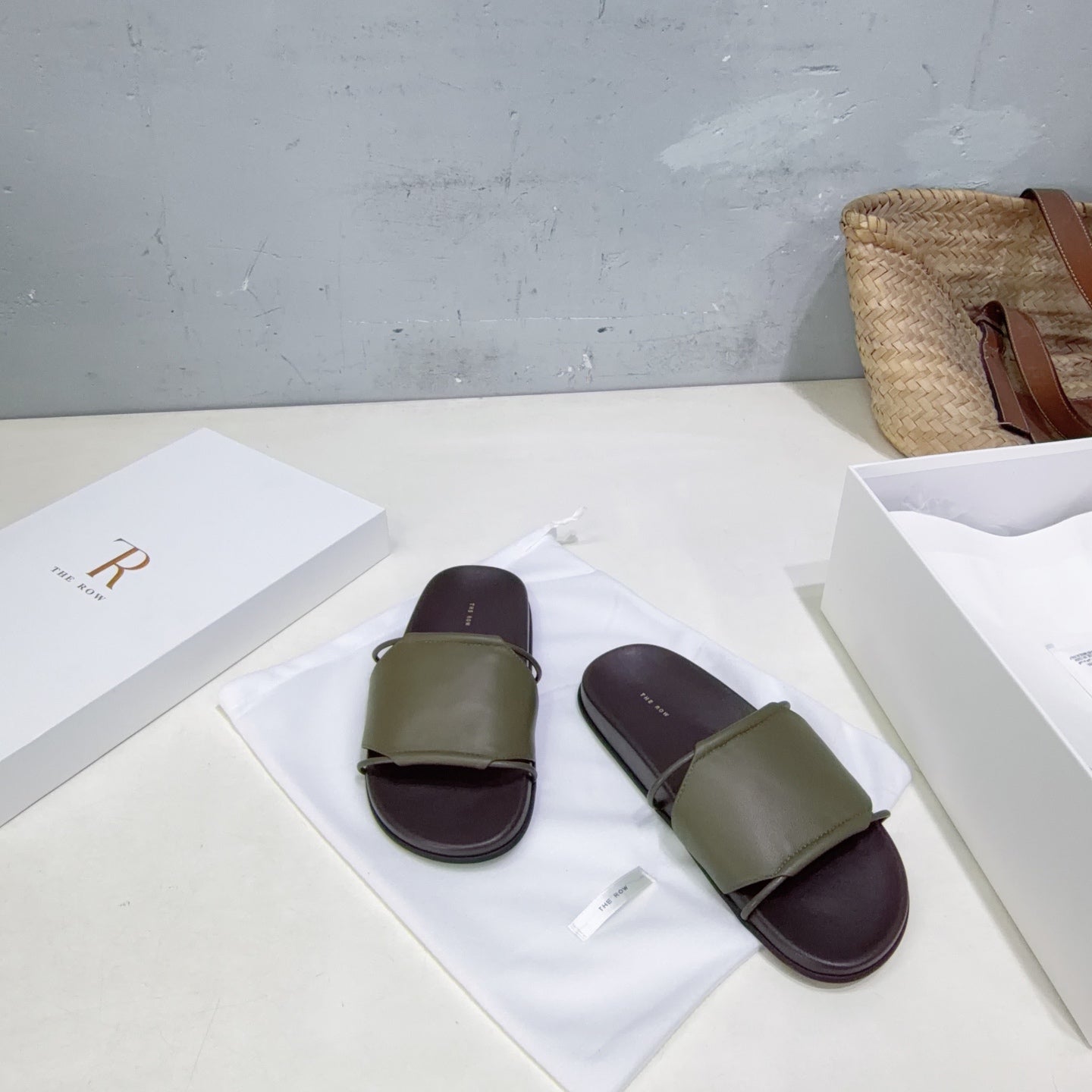 THE ROW 26S STRAP SLIDES IN OLIVE GREEN CALFSKIN