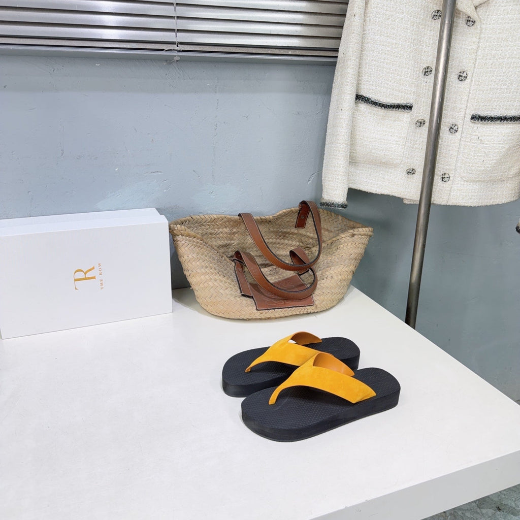 THE ROW 26S THONG SANDALS IN BLACK RUBBER  WITH GOLD YELLOW STRAPS