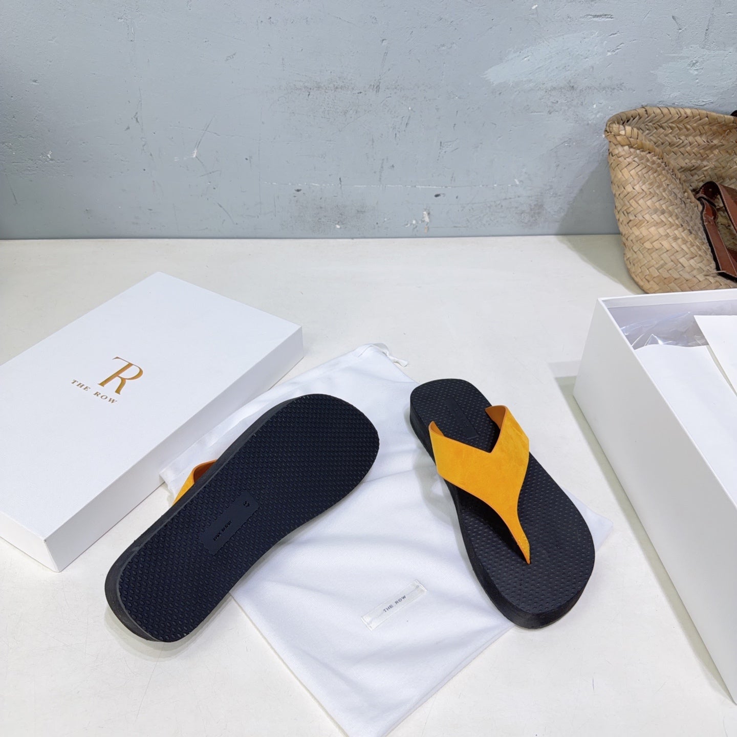THE ROW 26S THONG SANDALS IN BLACK RUBBER  WITH GOLD YELLOW STRAPS