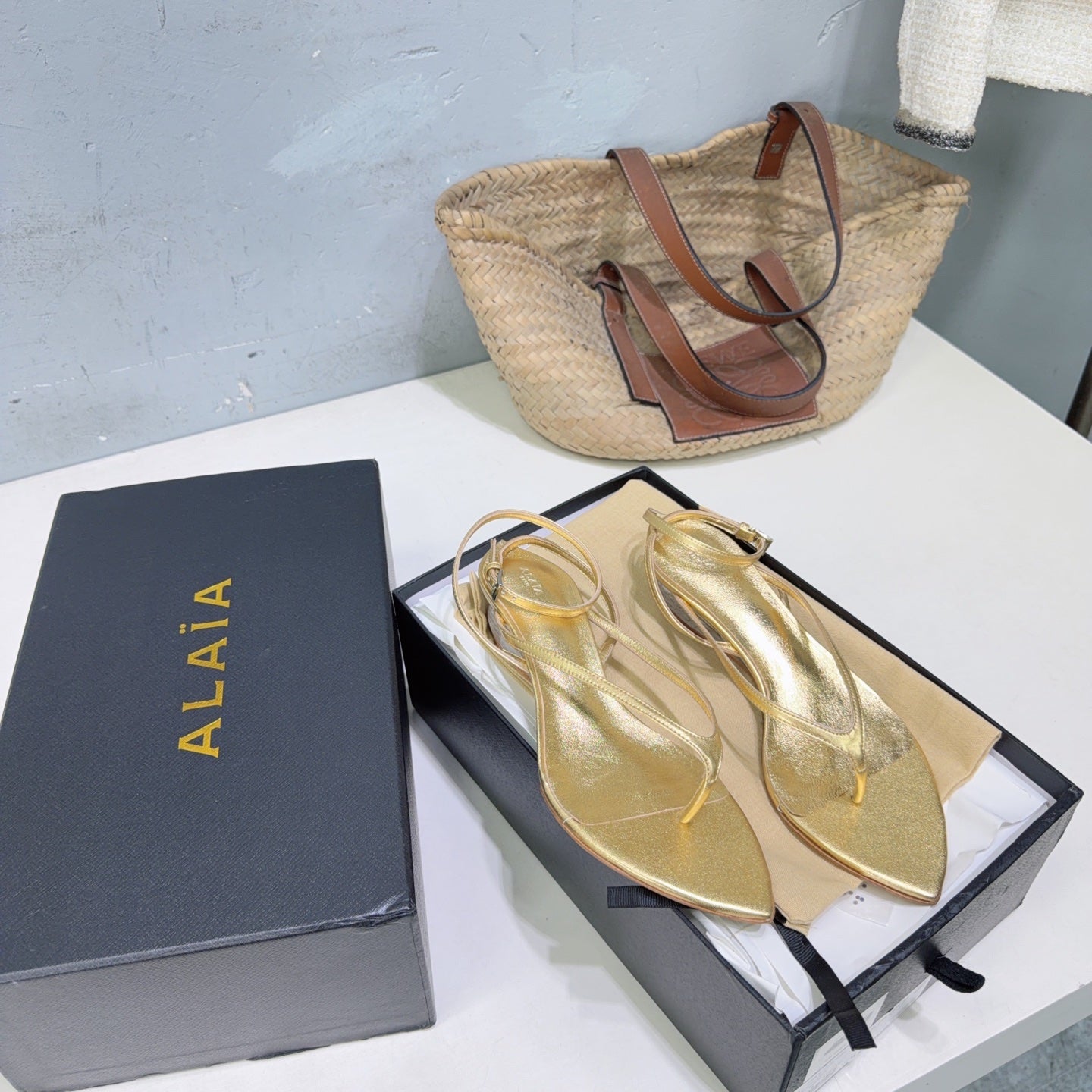 ALAIA 26S THONG SANDALS IN GOLD CALFSKIN
