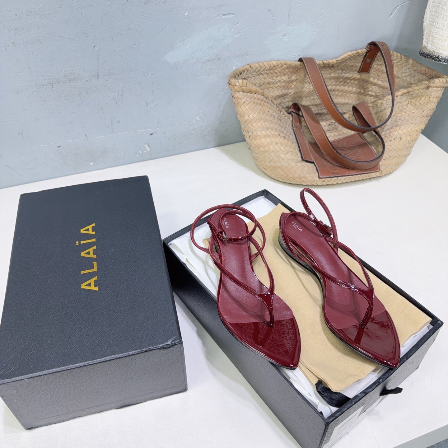 ALAIA 26S THONG SANDALS IN DARK RED CALFSKIN