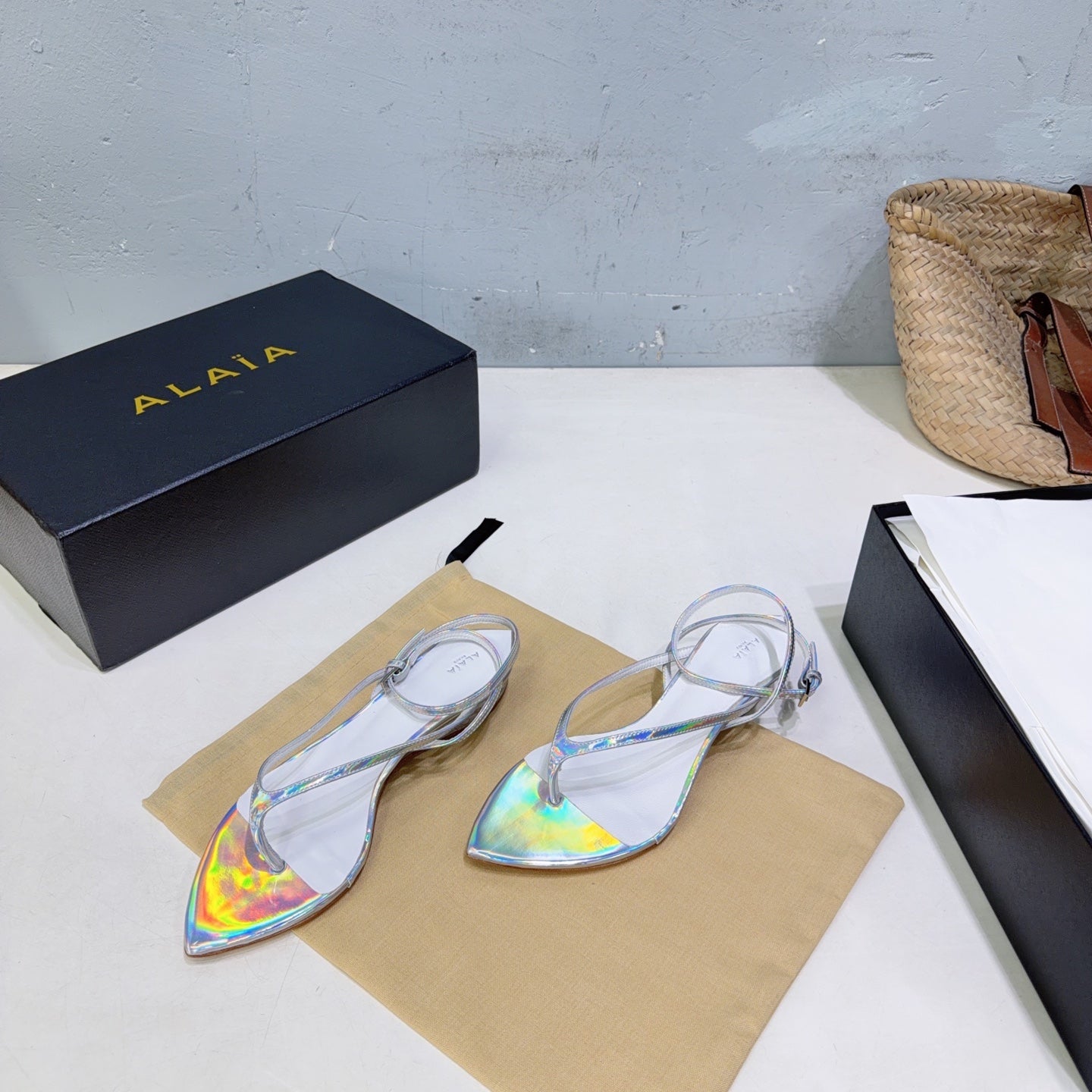 ALAIA 26S THONG SANDALS IN SILVER METALLIC CALFSKIN