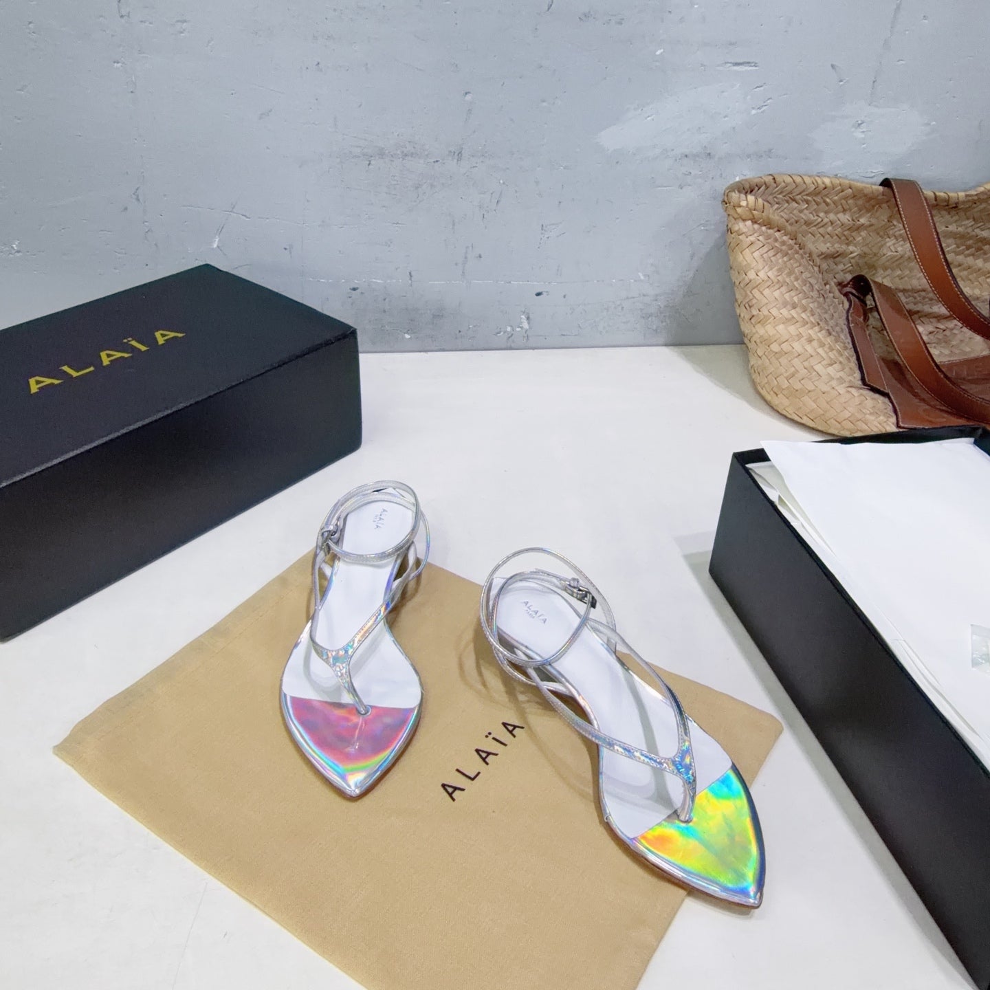 ALAIA 26S THONG SANDALS IN SILVER METALLIC CALFSKIN