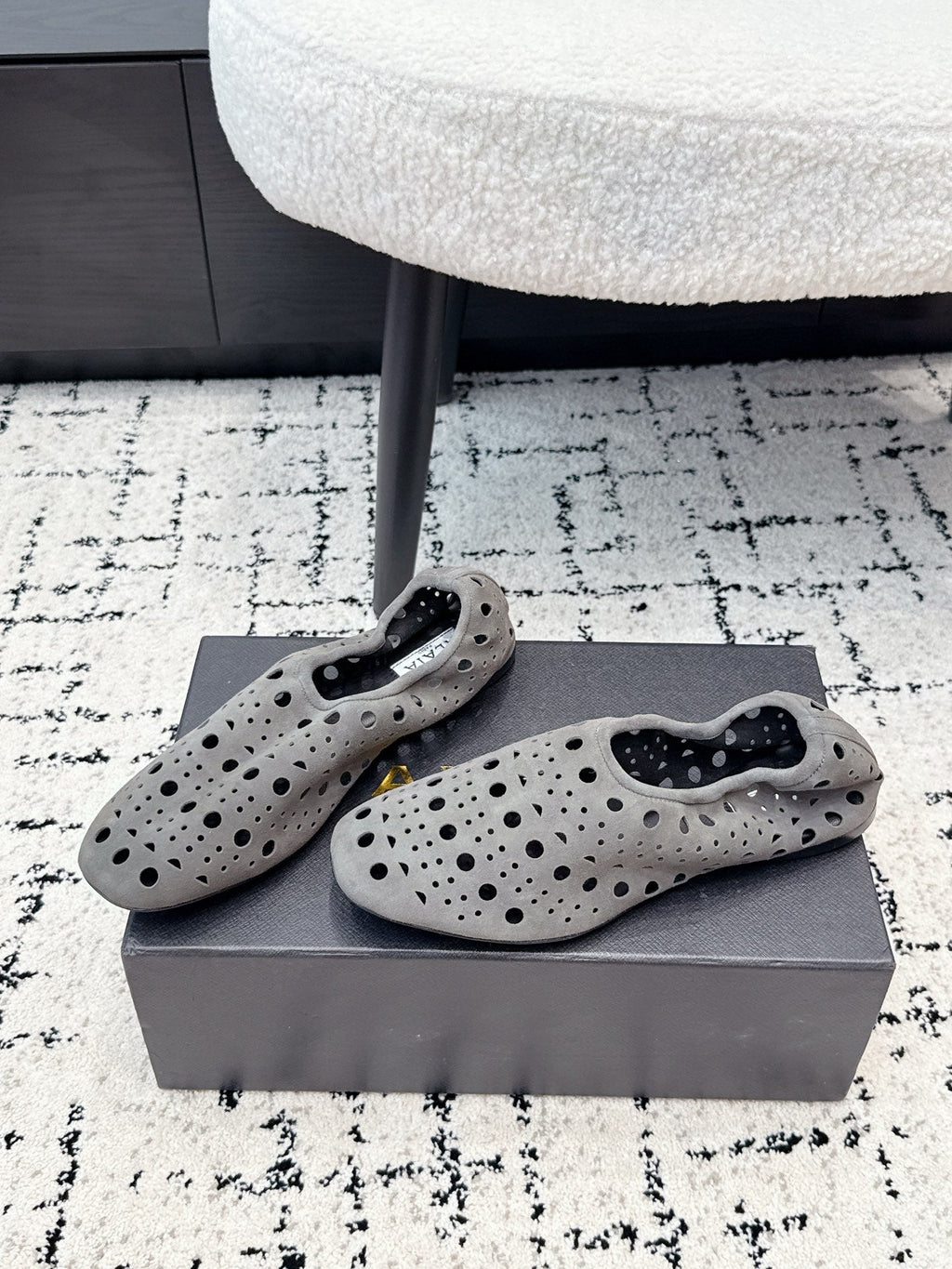 ALAIA 26S FLAT SLIP-ONS IN GREY SUEDE WITH OPENWORK PATTERN