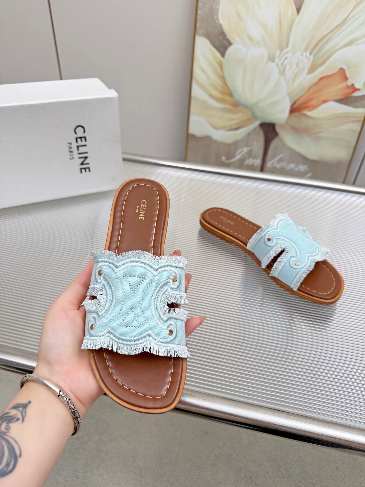 CELINE 26S TRIOMPHE SLIDE SANDALS IN SKY BLUE CANVAS