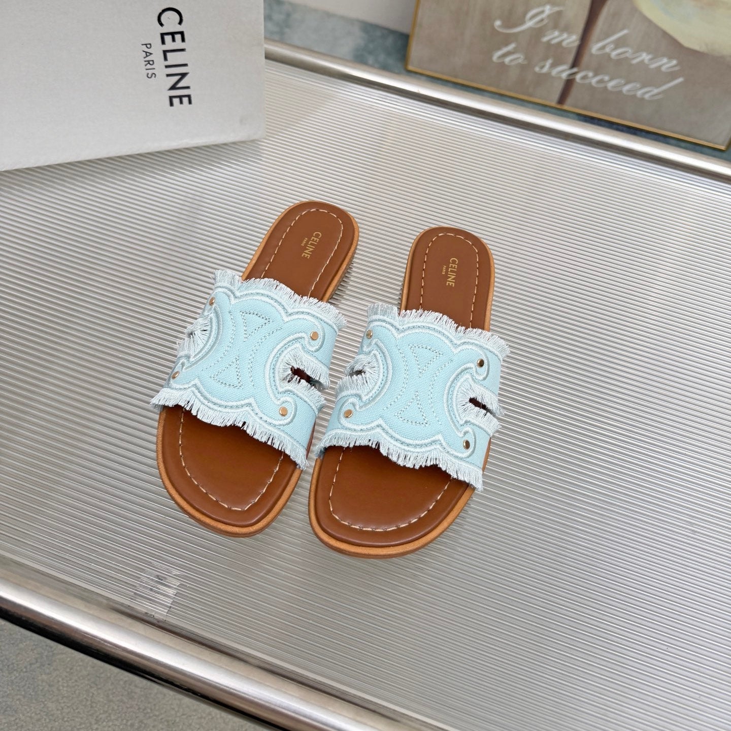 CELINE 26S TRIOMPHE SLIDE SANDALS IN SKY BLUE CANVAS
