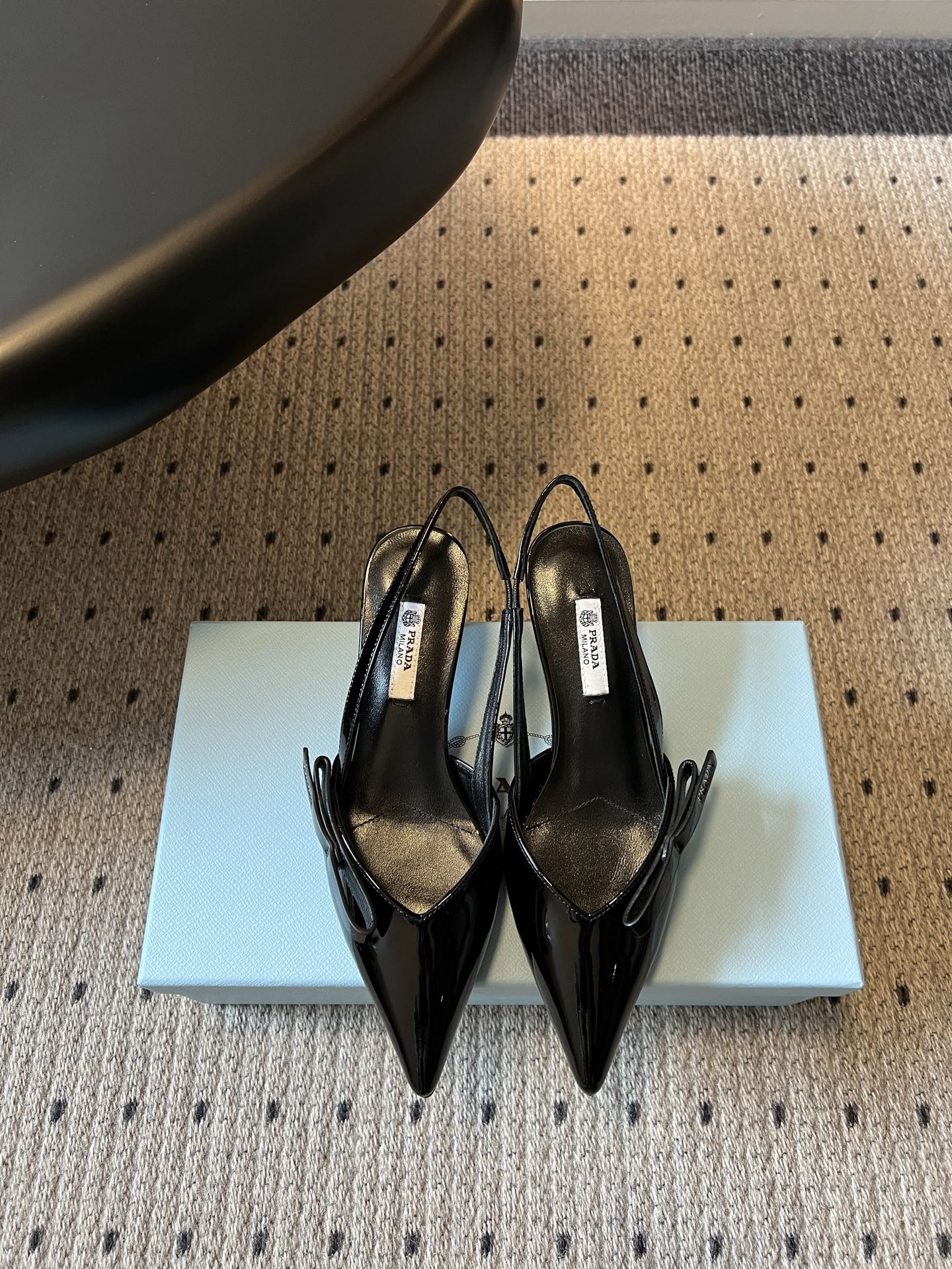 PRADA 26S BOW DETAIL SLINGBACK PUMPS 55MM IN BLACK PATENT CALFSKIN