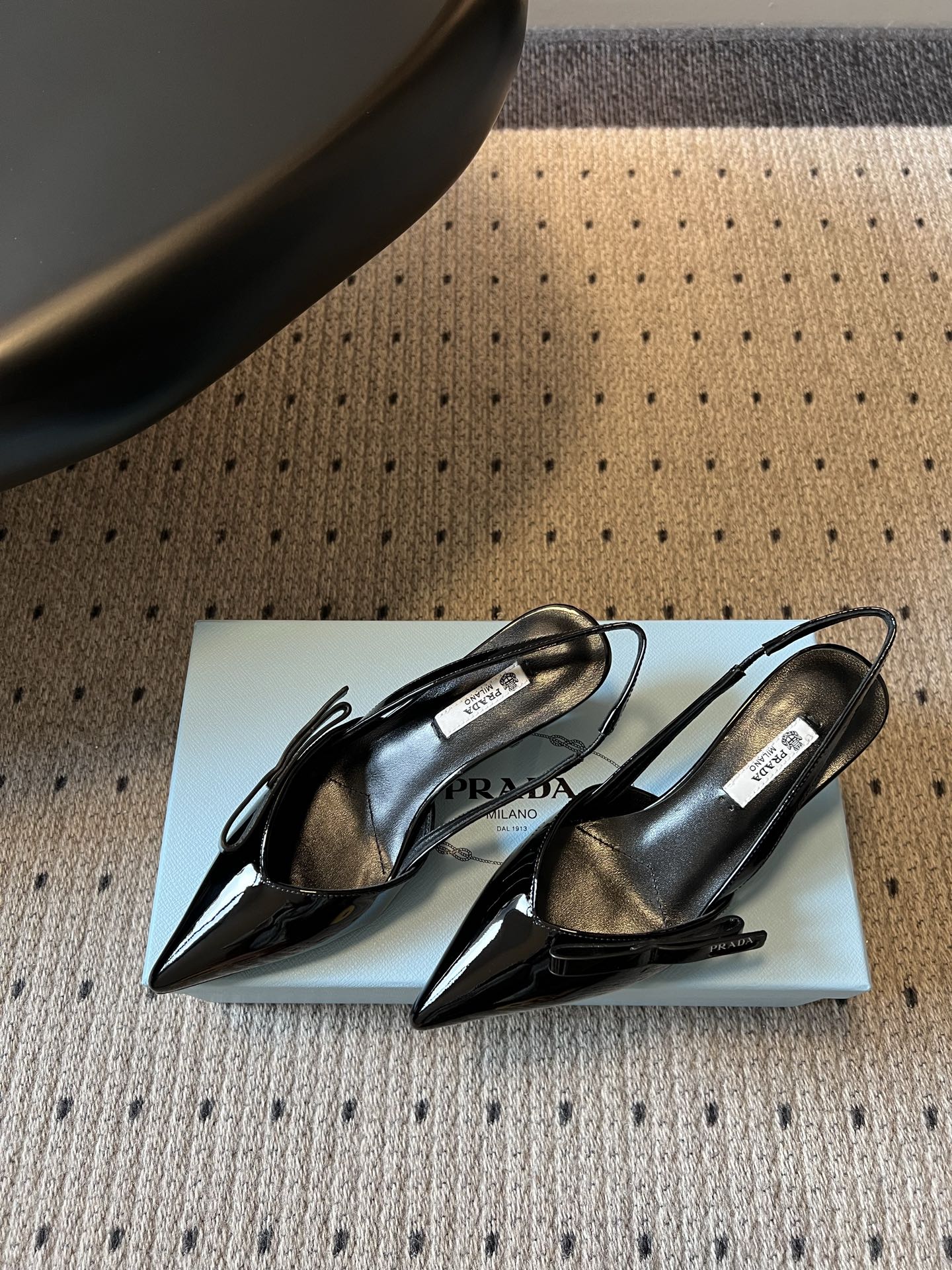 PRADA 26S BOW DETAIL SLINGBACK PUMPS 55MM IN BLACK PATENT CALFSKIN